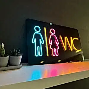 yan açıdan çekilmiş bayan erkek figürlü neon wc tuvalet tabelası